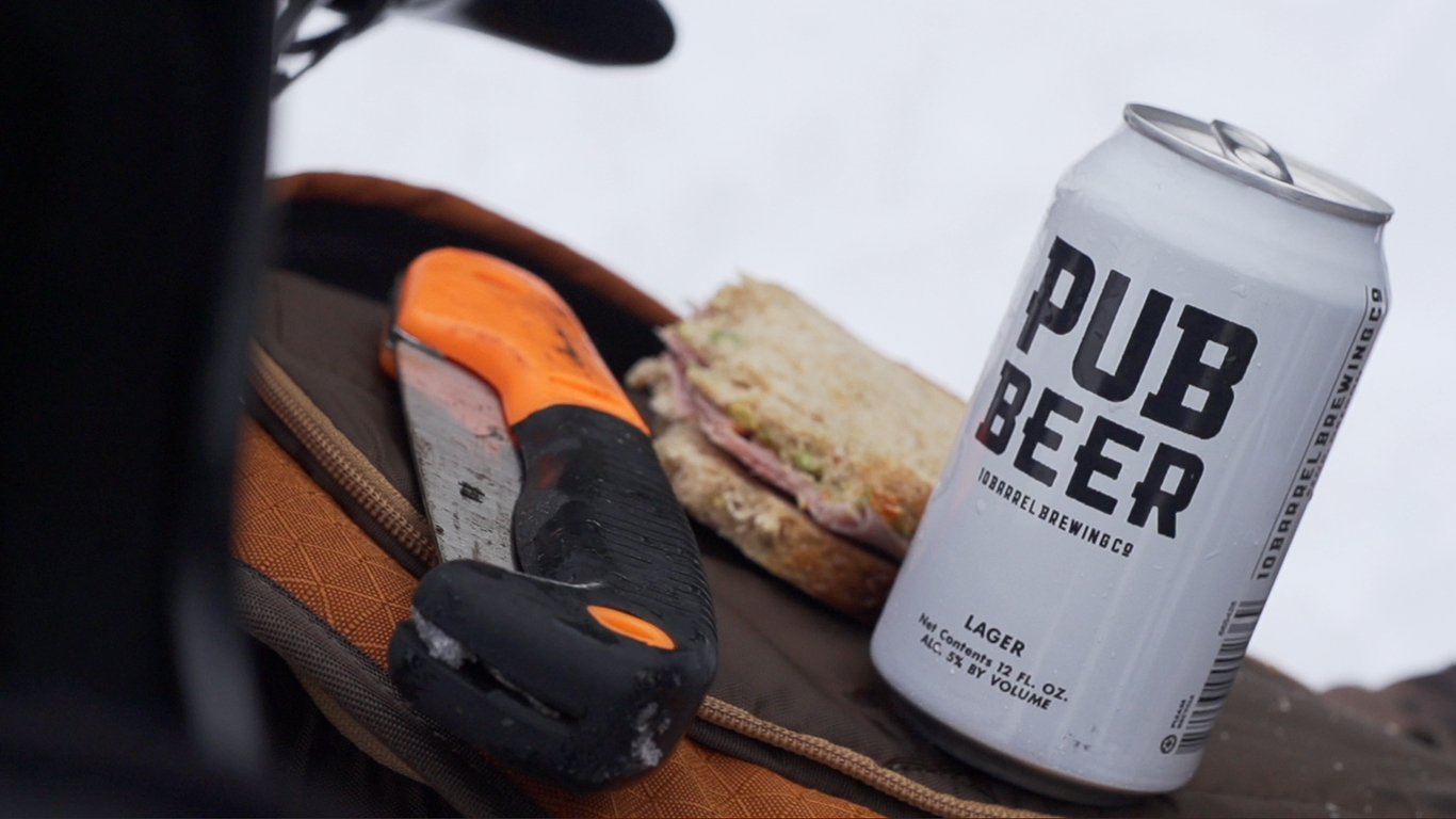 Backcountry essentials: Folding saw. Pub Beer. Ham sammy.