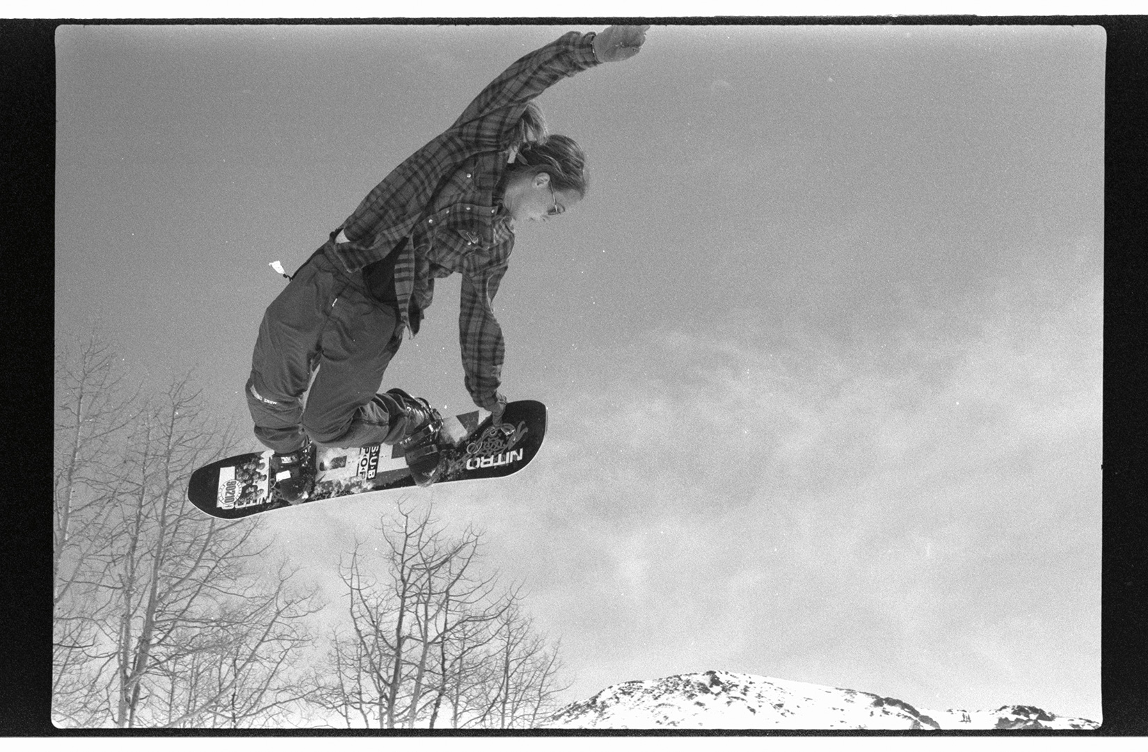 Andy Wright grabs his method outside of the bindings at the Mt. Holly Challenge in Brian Head, UT, in 1992. 