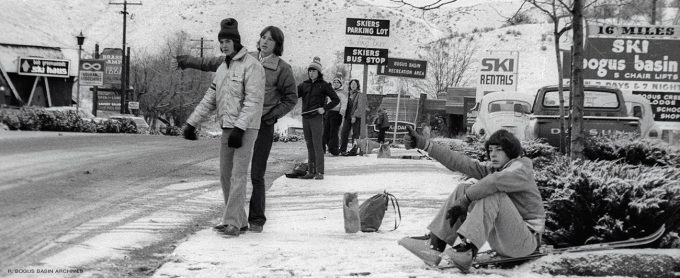 Hitchhiking skiers.