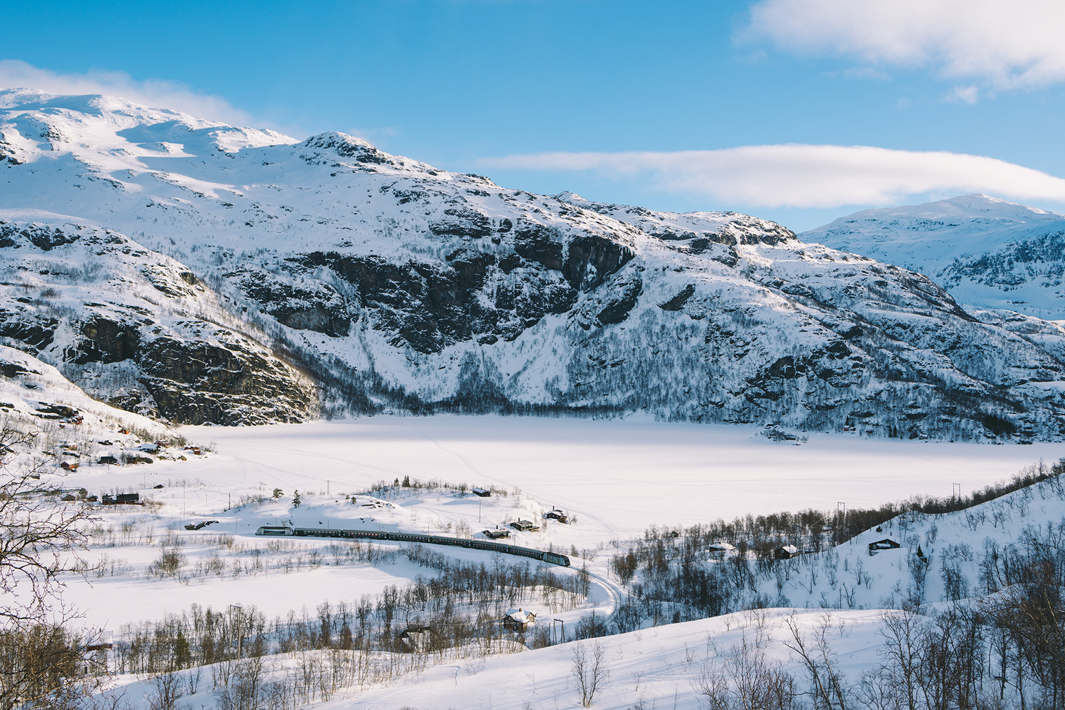 The Flåm Railway surrounded by the beautiful Flåmsdalen Valley. 