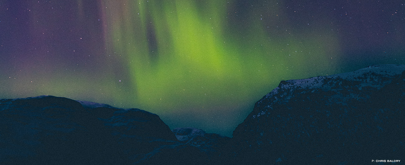 Aurora borealis illuminate the sky above Norway.